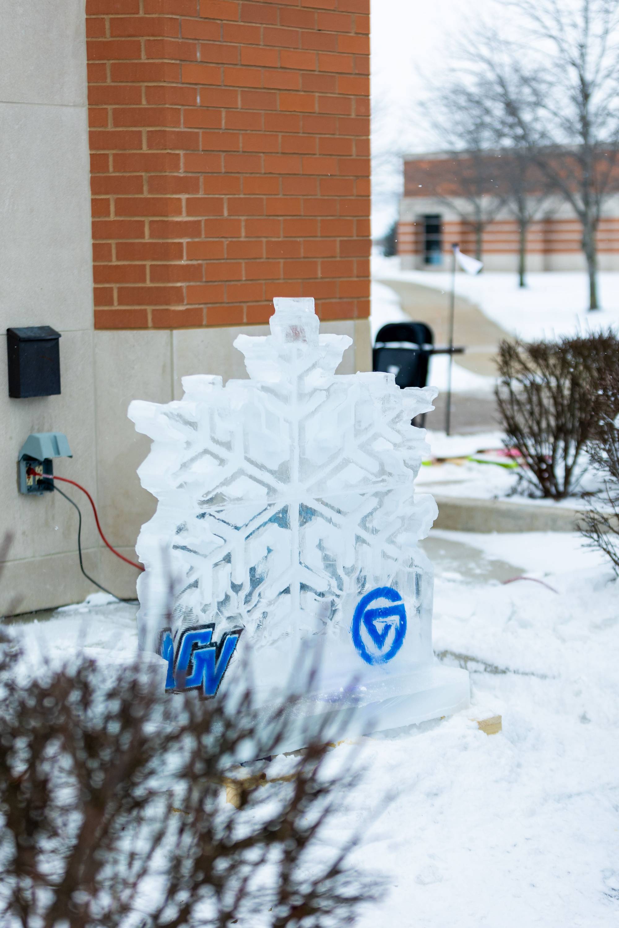 Snowflake ice sculpture with two GVSU logos